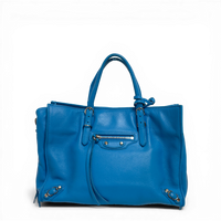 Balenciaga Classic City tote bag in blue lambskin leather with metallic studs and long tassel zippers.