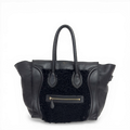 Celine Phantom Luggage tote bag in black leather and shearling with signature side wings and brass hardware.