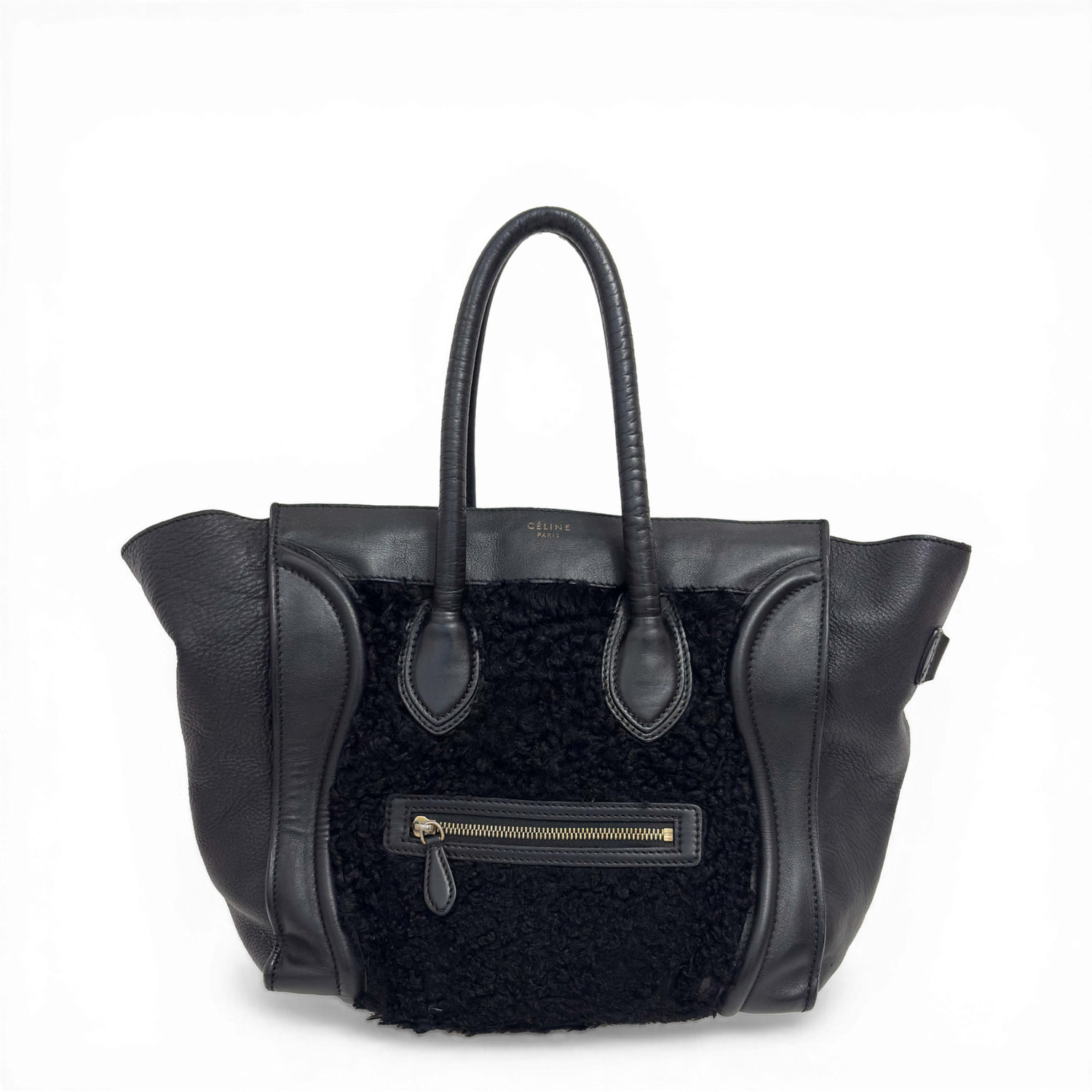 Celine Phantom Luggage tote bag in black leather and shearling with signature side wings and brass hardware.