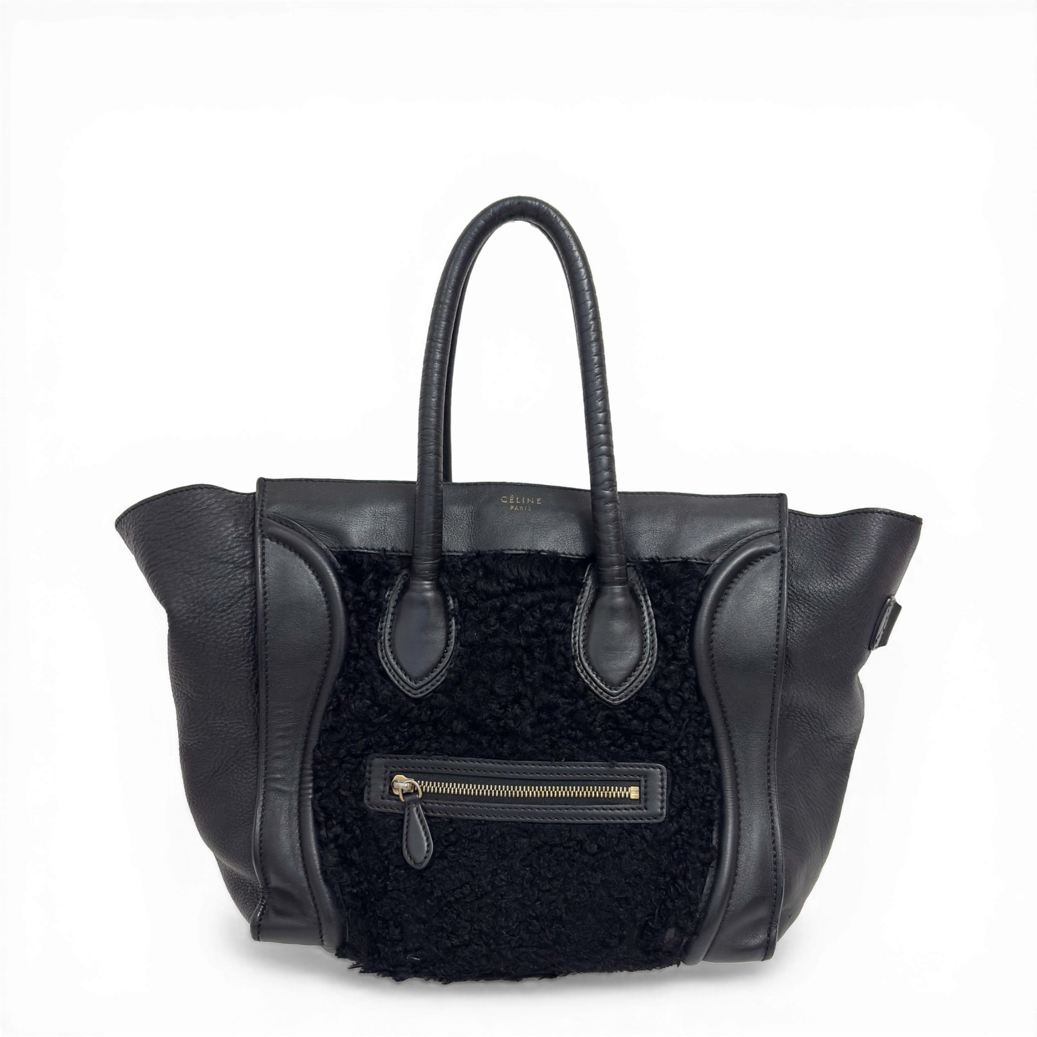 Celine Phantom Luggage tote bag in black leather and shearling with signature side wings and brass hardware.