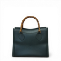 Gucci Diana tote bag in green calfskin leather featuring signature bamboo top handles.