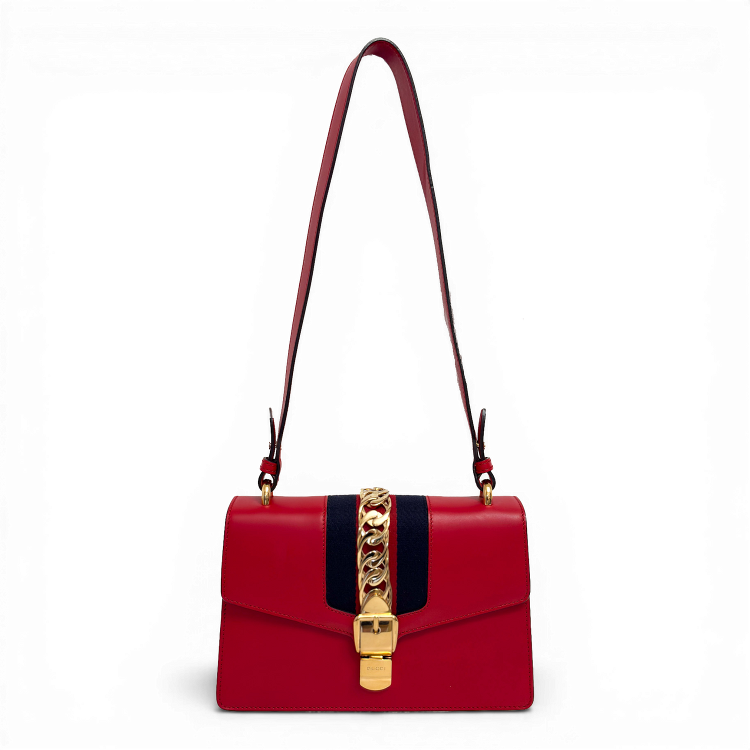 Gucci Sylvie shoulder bag in red leather with signature web stripe and gold-tone chain buckle detail.