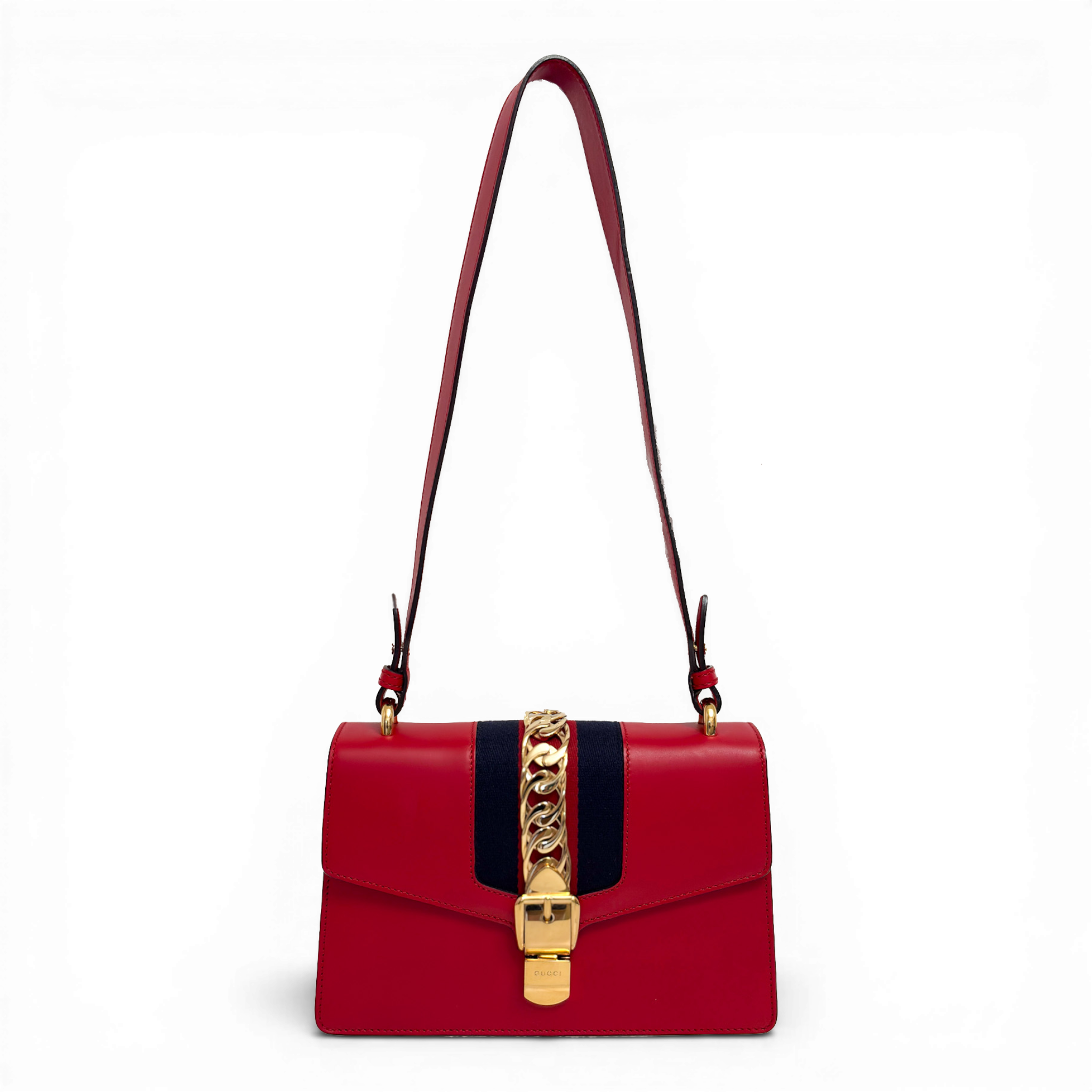 Gucci Sylvie shoulder bag in red leather with signature web stripe and gold-tone chain buckle detail.