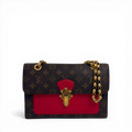 Louis Vuitton Monogram Victoire shoulder bag in Cherry red leather with gold sliding chain strap.