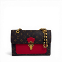 Louis Vuitton Monogram Victoire shoulder bag in Cherry red leather with gold sliding chain strap.