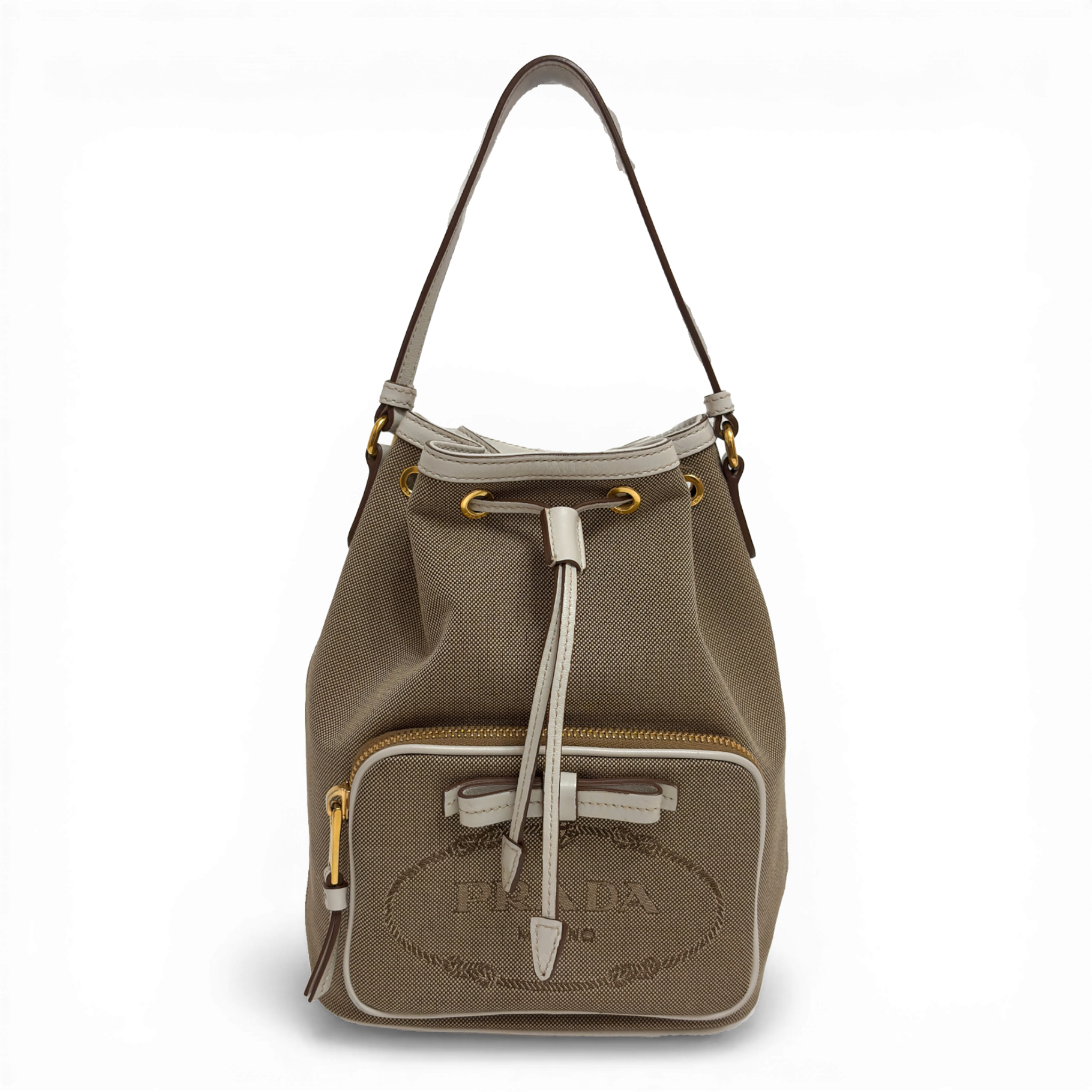 Prada Canvas Bucket Bag in beige with embroidered logo, detachable shoulder strap, and zippered pouch.