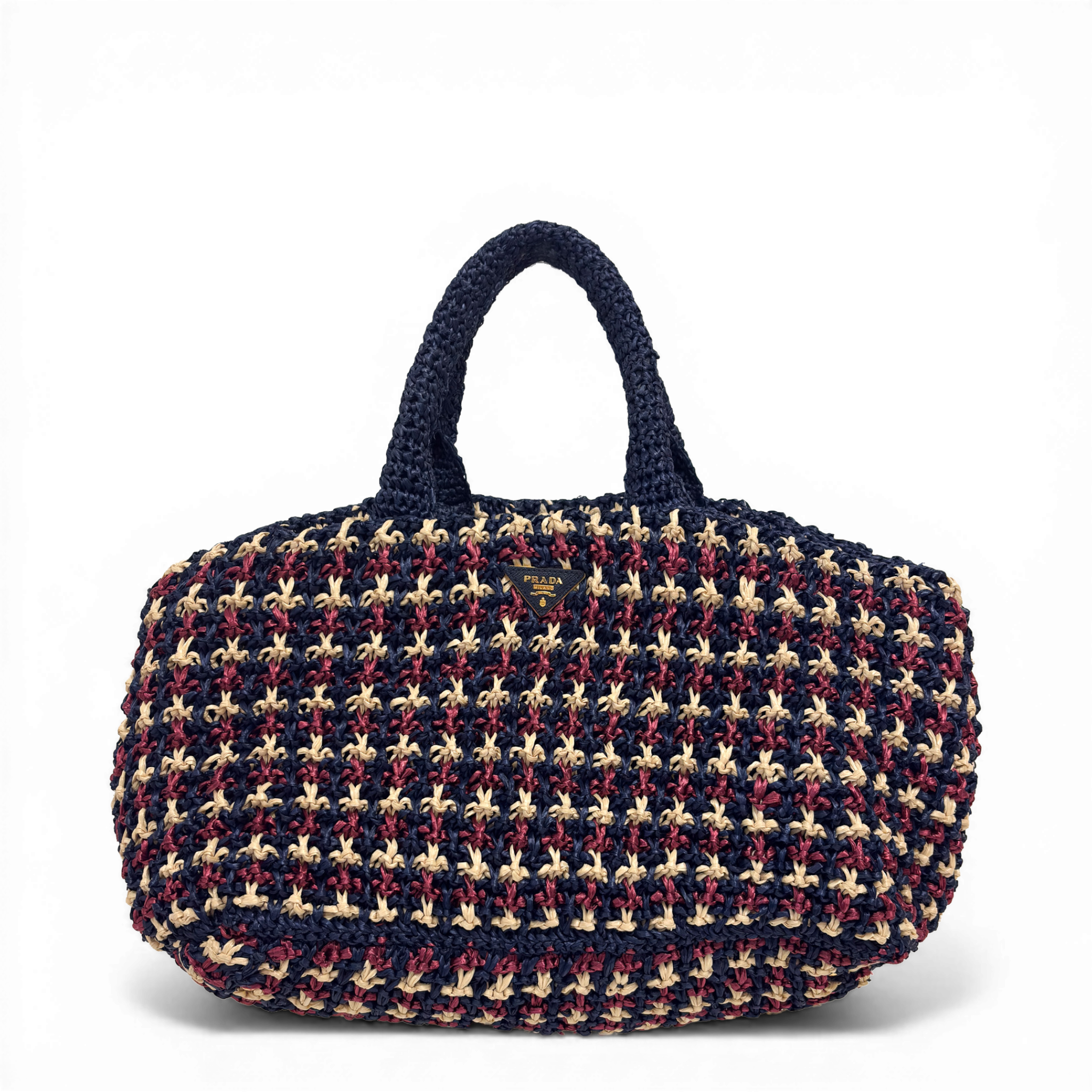 Prada Crochet Raffia Tote Bag in multicolor navy, beige, and red with enameled triangle logo.